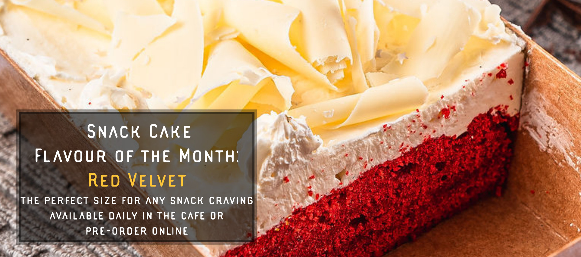 A cut piece of Red Velvet Snack Cake of the month is shown